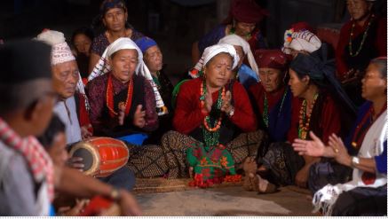 Community members performing traditional folk songs to convey disaster messages.