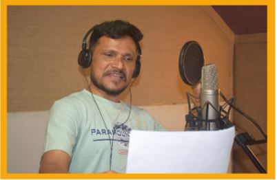 Well-known film actor Rabindra Jha recording a radio PSA on fire hazards.